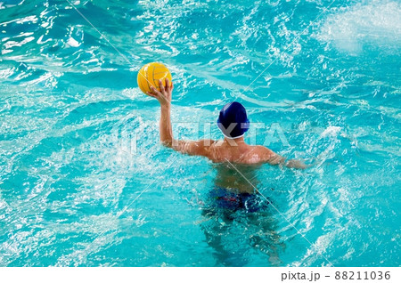 Young men play water polo 88211036