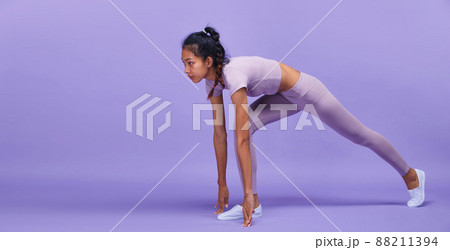 Full length of Asian slim tanned skin Fitness woman hands touch ground floor ready to start to run Full length of Asian slim tanned skin Fitness woman hands touch ground floor ready to start to run 88211394