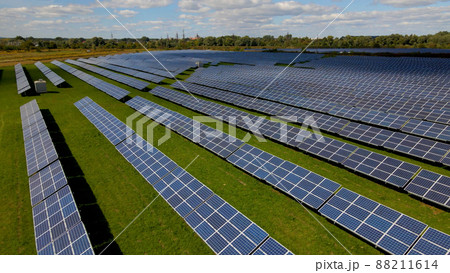 Drone shot of solar panel rows at a solar power facility Drone shot of solar panel rows at a solar power facility 88211614