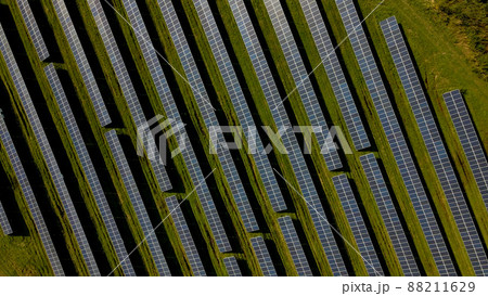 Drone shot of solar panel rows at a solar power facility 88211629