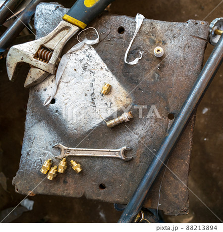 Repair tools placed on grunge rusted metal table Repair tools placed on grunge rusted metal table 88213894