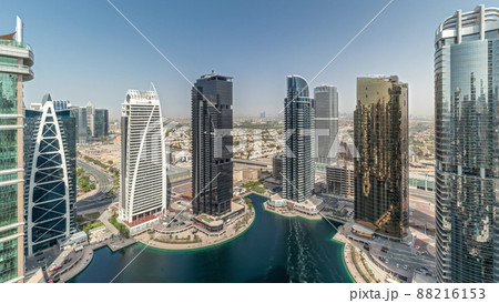 Panorama showing tall residential buildings at JLT aerial timelapse, part of the Dubai multi commodities centre mixed-use district. Panorama showing tall residential buildings at JLT aerial timelapse, part of the Dubai multi commodities centre mixed-use district. 88216153