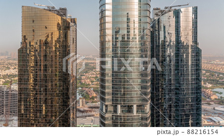 Tall residential buildings at JLT aerial timelapse, part of the Dubai multi commodities centre mixed-use district. Tall residential buildings at JLT aerial timelapse, part of the Dubai multi commodities centre mixed-use district. 88216154
