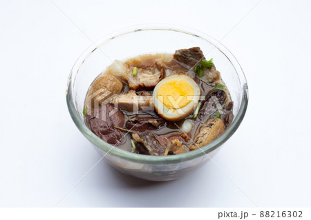 Boiled Chinese pasta square with pork soup Boiled Chinese pasta square with pork soup 88216302