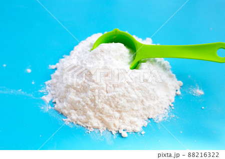 Baking soda on blue background. 88216322