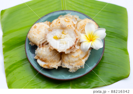 Khanom Krok, Thai coconut milk dessert. Coconut rice pancake Khanom Krok, Thai coconut milk dessert. Coconut rice pancake 88216342