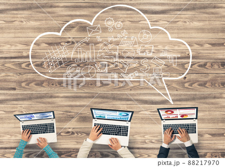 Top view of businesspeople sitting at table and using gadgets Top view of businesspeople sitting at table and using gadgets 88217970