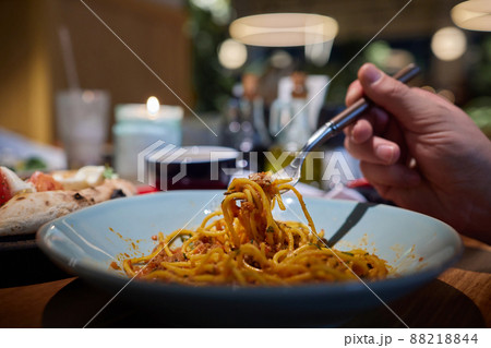 fresh hot spaghetti with cheese on fork with vapor, closeup, square format. fresh hot spaghetti with cheese on fork with vapor, closeup, square format. 88218844