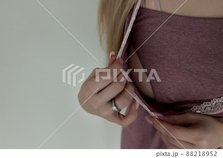 lothing design for breastfeeding. Happy pregnancy and maternity. Fashion style for young mothers. Clothes with a secret zipper for feeding the baby. 88218952