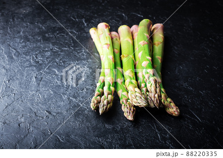 Green asparagus sprout on black board 88220335