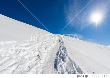 Winter Landscape with Snow against a Clear Blue Sky with Sunbeams Winter Landscape with Snow against a Clear Blue Sky with Sunbeams 88220642