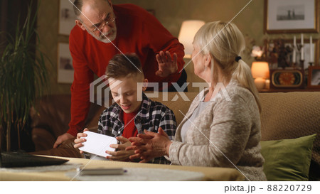 Cheerful aged woman in VR glasses Cheerful aged woman in VR glasses 88220729