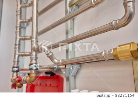 Plumbing service. copper pipeline of a heating system in boiler room. 88221154