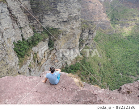 boy at the edge of the rock, in the rock valley on Chapada Diamantina, Brazil boy at the edge of the rock, in the rock valley on Chapada Diamantina, Brazil 88222336