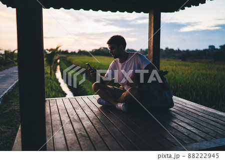 Tourist using mobile to find way in tropical countryside 88222945
