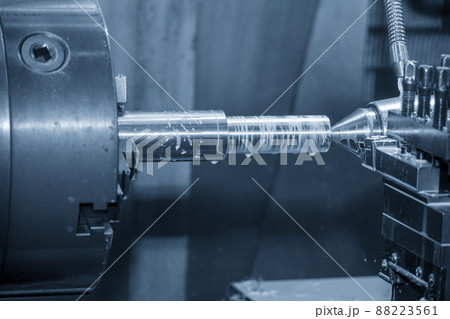 The lathe machine cutting  the metal  shaft parts with water base coolant method. 88223561