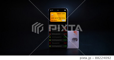 Online banking. Mobile phone with internet online bank app. Credit card on black background. Save money business wallet. Online banking. Mobile phone with internet online bank app. Credit card on black background. Save money business wallet. 88224092
