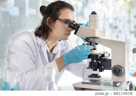 Scientists or researchers perform microscopic endoscopy to examine changes in the chemical reactions and degradation of cells, Lab experiments, Researchers scientist working analysis with test tube. 88224656