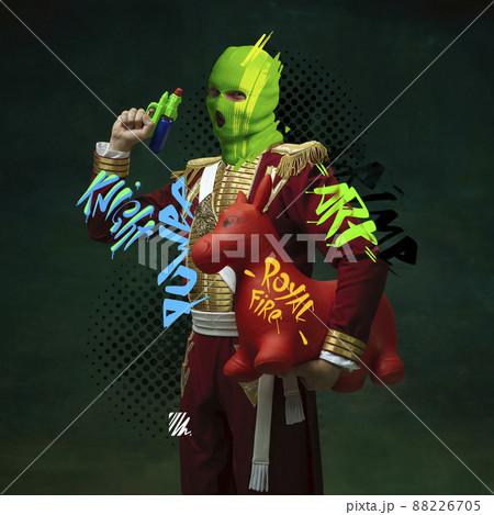 Contemporary art collage. Royal person, hussar in balaclava with toy gun and horse isolated over vintage green background Contemporary art collage. Royal person, hussar in balaclava with toy gun and horse isolated over vintage green background 88226705