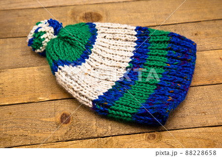Handmade wool knitted winter blue green and white hat 88228658