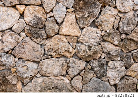 Background of limestone masonry. The surface is decorated with natural material. The wall is made of wild stone 88228821