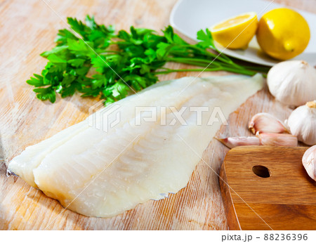 Fresh cod fillet with seasonings ready for cooking 88236396