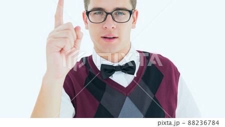 Caucasian man pointing his fingers upwards against copy space on white background 88236784