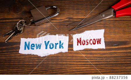 New York and Moscow. Sanctions and travel bans concept. Cut sheet of paper New York and Moscow. Sanctions and travel bans concept. Cut sheet of paper 88237356