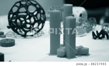 Abstract object of a blue color printed on a 3d printer on a white table. 88237493