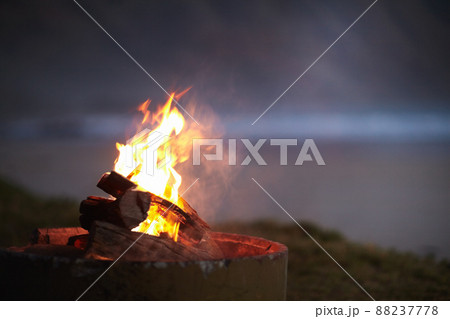 A camping necessity. Cropped view of a fire burning outdoors. 88237778