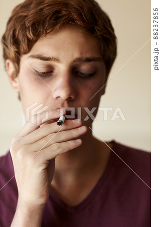 Just trying it out.... Closeup of a person smoking a cigarette. Just trying it out.... Closeup of a person smoking a cigarette. 88237856