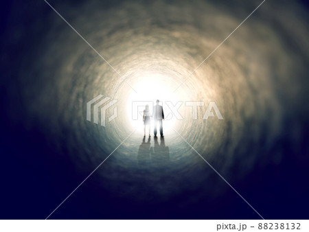 Finding the light. A shot of two people finding an exit from a dark tunnel - ALL design on this image is created from scratch by Yuri Arcurs team of professionals for this particular photo shoot. 88238132