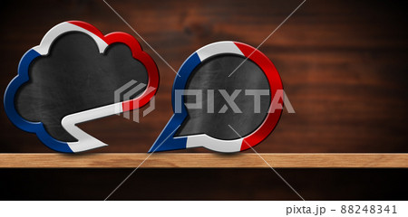 Two Empty Speech Bubbles with French Flag on a Wooden Shelf Two Empty Speech Bubbles with French Flag on a Wooden Shelf 88248341