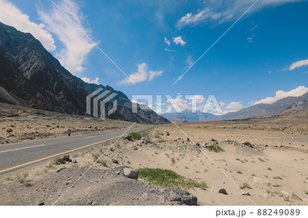 Asphalt Road in the High Gilgit Baltistan Mountains under the Blue Clouds, Pakistan 88249089
