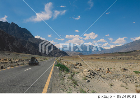 Asphalt Road in the High Gilgit Baltistan Mountains under the Blue Clouds, Pakistan Asphalt Road in the High Gilgit Baltistan Mountains under the Blue Clouds, Pakistan 88249091