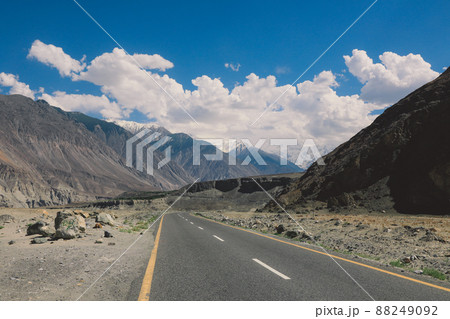 Asphalt Road in the High Gilgit Baltistan Mountains under the Blue Clouds, Pakistan Asphalt Road in the High Gilgit Baltistan Mountains under the Blue Clouds, Pakistan 88249092