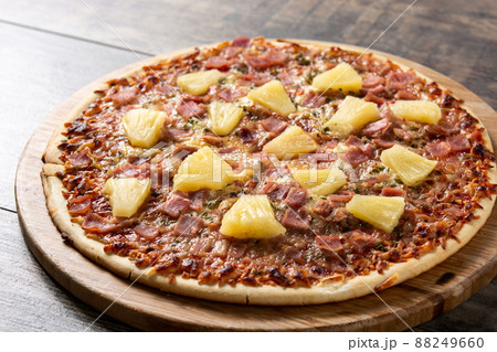 Hawaiian pizza with pineapple,ham and cheese Hawaiian pizza with pineapple,ham and cheese 88249660