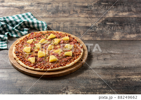 Hawaiian pizza with pineapple,ham and cheese 88249662
