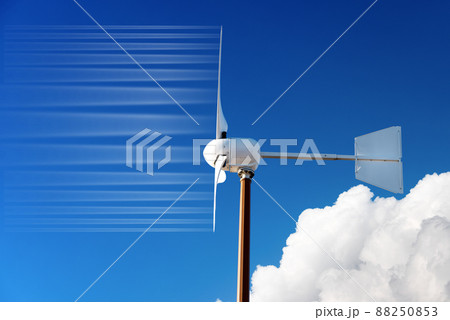 Closeup of a Small Wind Turbine against a Clear Blue Sky and Clouds Closeup of a Small Wind Turbine against a Clear Blue Sky and Clouds 88250853