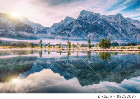 Spectacular autumn scene of foggy and sunny morning on Almsee lake. Spectacular autumn scene of foggy and sunny morning on Almsee lake. 88252037