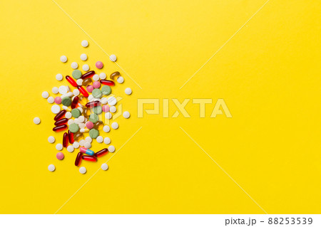 Protective face masks or surgical masks, medicine pills and thermometer on table background. Coronavirus disease. Corona virus concept. Space for text 88253539