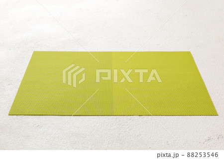 Perspective view of green tablecloth for food on cement background. Empty space for your design Perspective view of green tablecloth for food on cement background. Empty space for your design 88253546