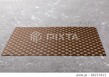 Perspective view of brown tablecloth for food on cement background. Empty space for your design Perspective view of brown tablecloth for food on cement background. Empty space for your design 88253815