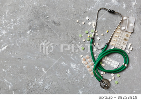 Medical background. Many different various medicine tablets or pills on the table with stethoscope. Close up. Healthcare pharmacy and medicine concept 88253819