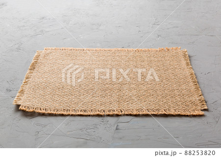Perspective view of brown tablecloth for food on cement background. Empty space for your design Perspective view of brown tablecloth for food on cement background. Empty space for your design 88253820