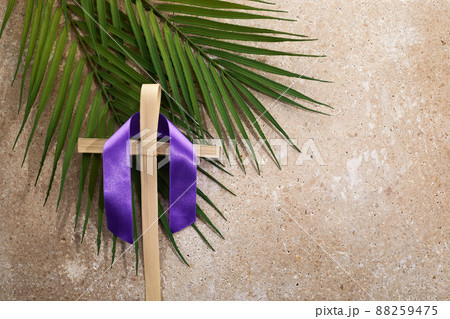 Palm cross and palm leaves. Palm sunday and easter day concept. Palm cross and palm leaves. Palm sunday and easter day concept. 88259475