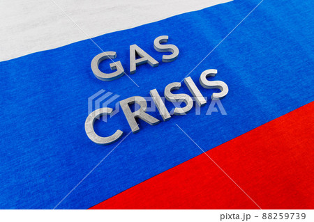 the words gas crisis laid with silver letters over flat russian flag surface 88259739