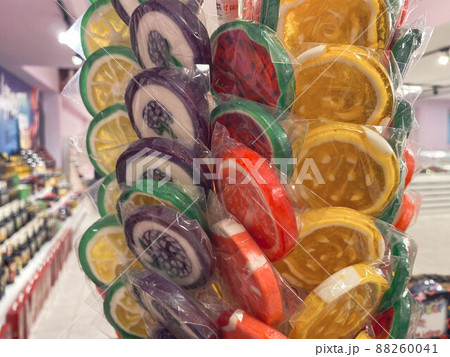 Colorful wrapped lollipops on display, hand made candy, small and big lollipops. Colorful wrapped lollipops on display, hand made candy, small and big lollipops. 88260041