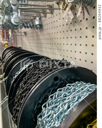 A row of Spools of chain links at retail store 88264932