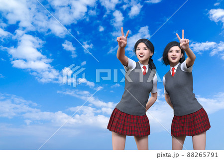 青空が続く広い空を背景に二人の女子生徒が明るい笑顔を浮かべながらピースサインをしている 88265791